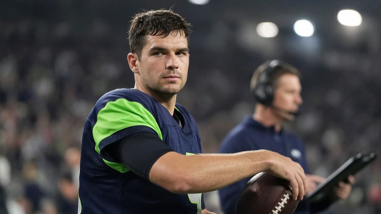 Illustrative view of a backup NFL quarterback warming up on the sideline