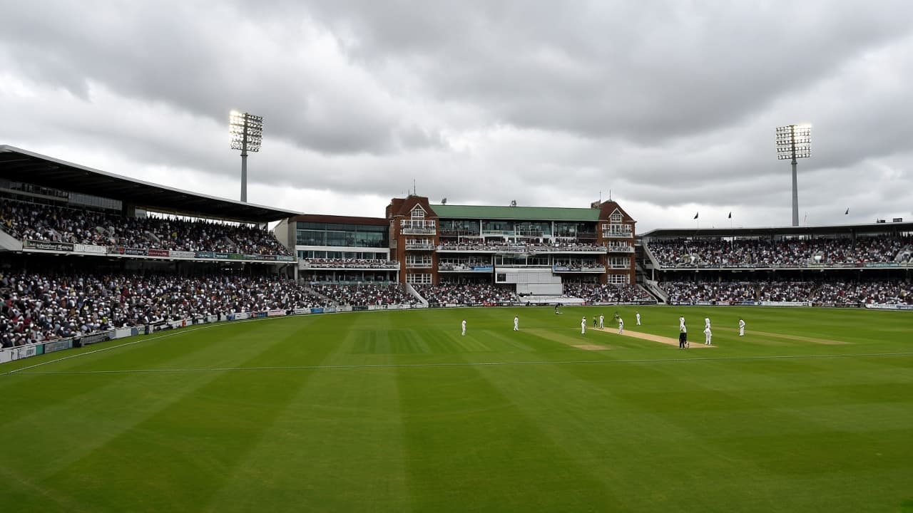 English Test cricket ground under grey skies during a match day