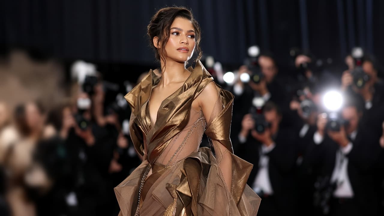 Illustrative red carpet scene with a sculptural couture gown
